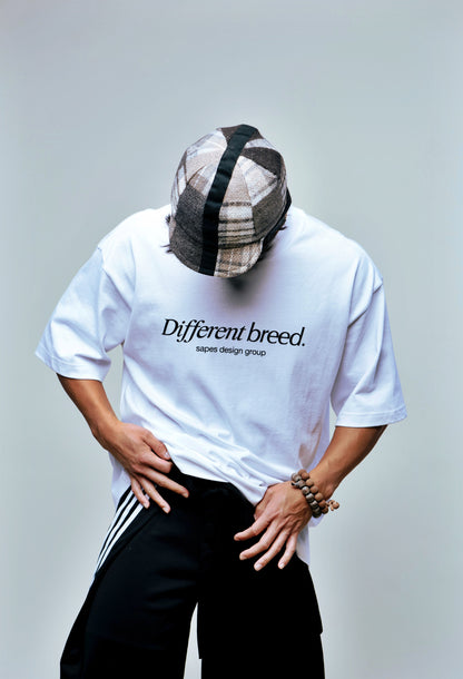 Different Breed Tee displaying front graphic on model.